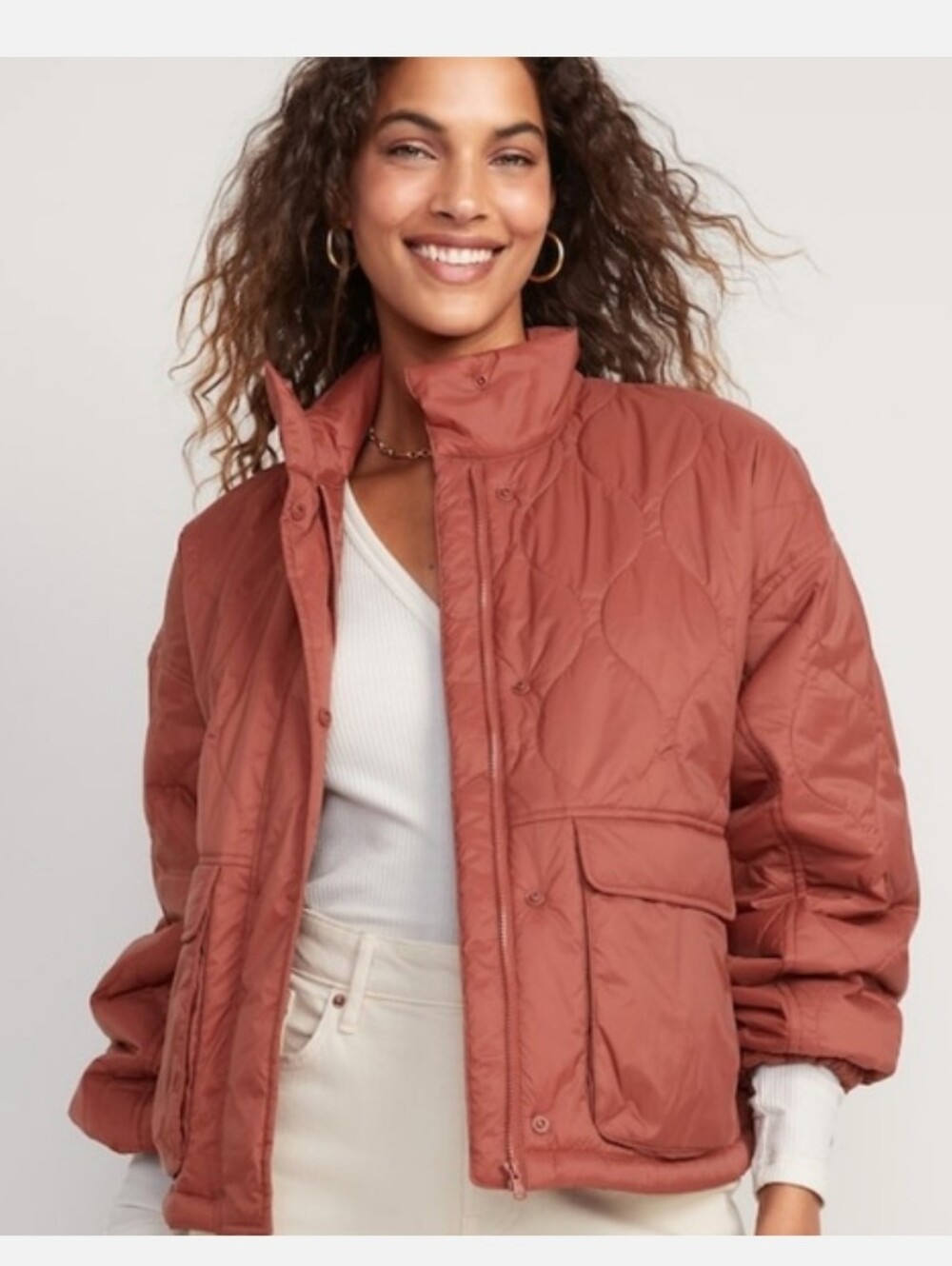 rusty-coral colored Puffer quilted jacket is from Old Navy